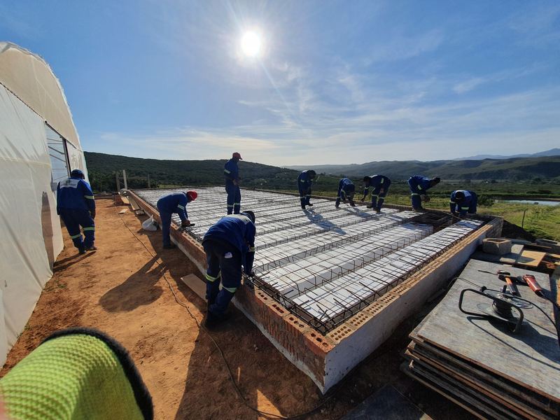 Workers preparing a reinforced concrete slab
