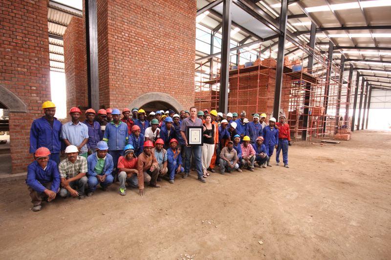 Site team in hard hats in the kiln hall