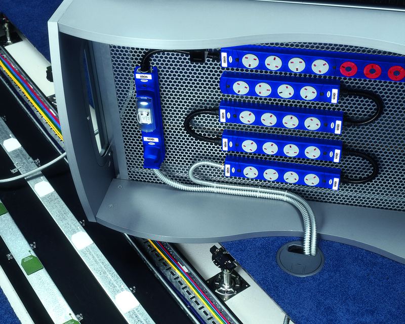 Blue rotating socket modules fitted in a desk